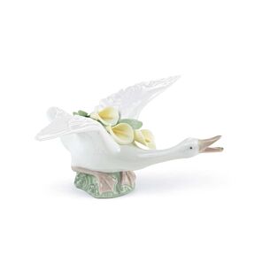 Flying duck with yellow lillies